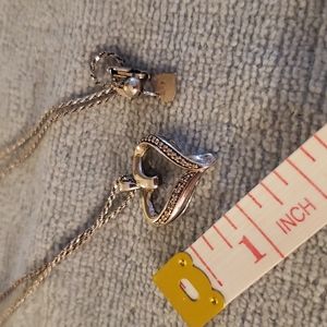 Silver heart necklace with diamond chips.